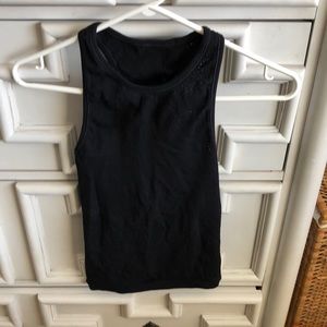 Lululemon black high neck tank with lace cutout detailing. Size 2 I think.
